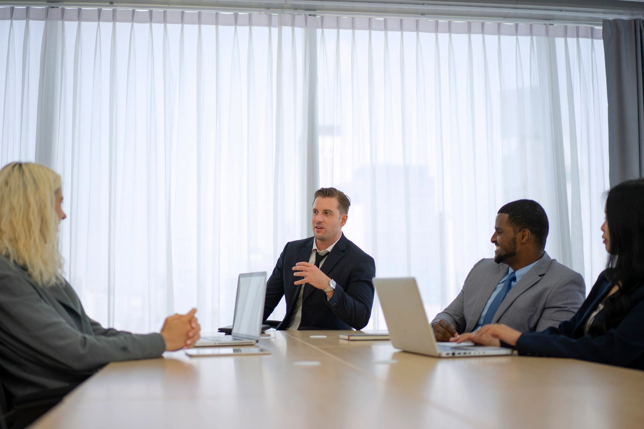Agency team meeting around a conference table