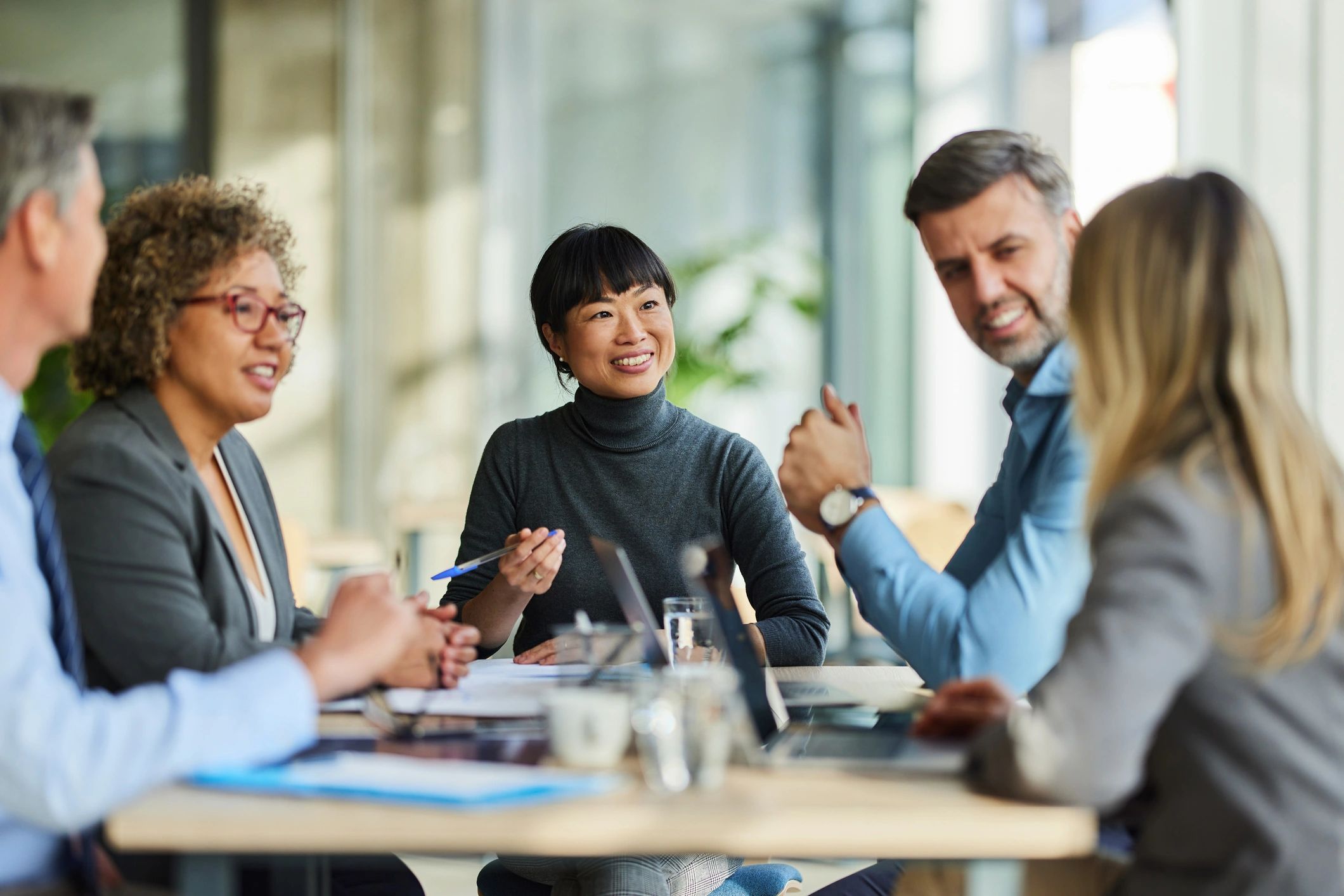 Multiracial business team collaborating in an office meeting