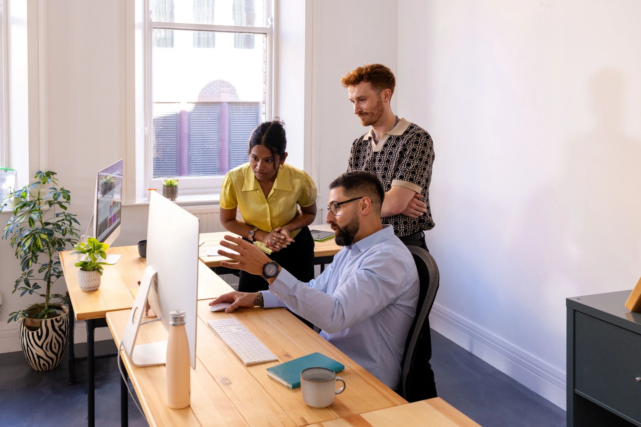 Marketing strategy discussion in a modern agency workspace
